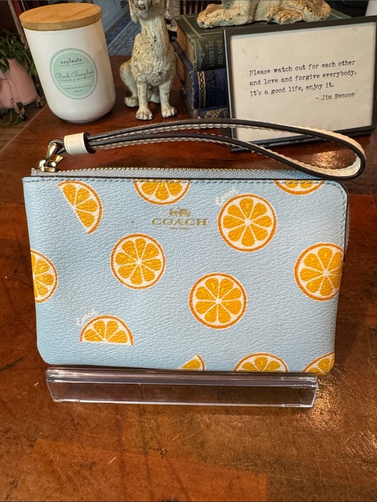 Coach Handbags - Coach Light Blue Wristlet with Orange Slice Print
